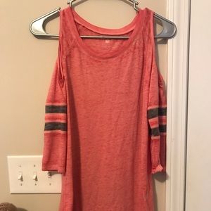 Pink shirt with shoulder cut outs